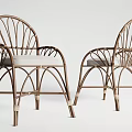 Elegant Rattan Leisure Chairs With Curved Frame And Light Colored Cushions