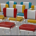 Colorful Modern Chairs With Red Yellow Blue Seats White Backs And Metal Legs