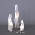 Three Geometric White Floor Lamps with Polygonal Design Illuminated Modern Interior