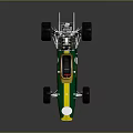 Green and yellow race car model with four wheels white dot and reflective gray background