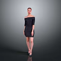 Woman in Black Off Shoulder Dress Standing Against Gray Background with High Heels