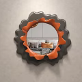 Stylish Mirror With Black And Orange Wavy Frame Mounted On Gray Wall Reflecting Sofa Pillows