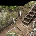 Metal Staircase In Natural Setting With Rock Walls Green Plants And Dirt Ground