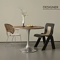 Modern Minimalist Round Dining Table with Wooden Top Metal Base Vase Plant and Two Chairs