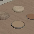 Four Different Styles Round Woven Floor Cushions Placed On Wooden Floor