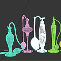 Vintage Decorative Perfume Bottles With Ornate Gold Accents And Colorful Designs