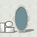 Ornate Oval Mirror With Carved Frame And Small Square Round Mirrors On Light Wall