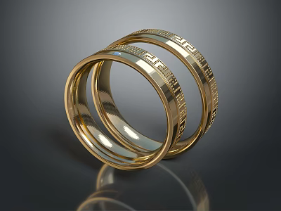Shiny Gold Rings With Intricate Engraved Patterns Stacked Together 3d model