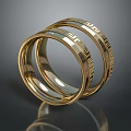 Shiny Gold Rings With Intricate Engraved Patterns Stacked Together 3d model