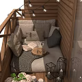 Outdoor Sofa with Decorative Pillows on Wooden Deck Featuring String Lights Lanterns and Small Plants
