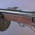 Classic Vintage Weapon Featuring Black Barrel Wooden Stock and Circular Drum Magazine