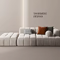Minimalist Cream Colored Modular Three Seater Sofa with Plaid Brown Gray Pillows and Round Cushion