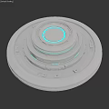 Silver Metallic Activation Device With Layered Circular Design And Blue Glowing Rings