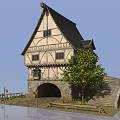 Medieval Half Timbered Building With Steep Roof Stone Archway Tree And Stone Wall