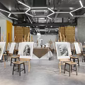 Art Studio For Book Art Featuring Easels With Portrait Drawings And Central Sculpture