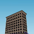 Historic Multi Story Building With Classical Facade Large Windows And Ornate Base