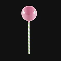 Sweet Pink Lollipop with Green Striped Stick on Black Background