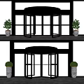 Modern Revolving Door Entrance With Glass Panels Metal Frame And Potted Plants Urban View