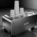 KAFFA Silver Kitchen Appliance With Stacked Paper Cups And Adjacent Paper Cups