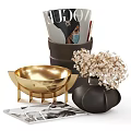 Elegant Carved Sculptural Decorations With Golden Bowl Black Vase White Flowers Magazines And Papers