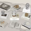 Stacked Books With Sculptures Cups And Small Decor In Minimalist Elegant Style