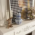 Classic White Carved Fireplace Mantel With Blue White Vase Flower Arrangement And Candles