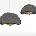 Two Modern Black Textured Pendant Lights Hanging Against Gray Background 3d model
