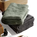 Assorted Bath Essentials Collection With Stacked Towels Wooden Storage Boxes Toiletry Bottles And Soap