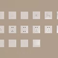 White Switch Panels with Various Sockets and Controls Mounted on Beige Wall