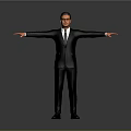 Man In Black Suit With Sunglasses Standing With Arms Outstretched Against Gray Background