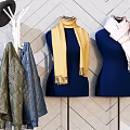 Stylish Clothes Hangers With Hanging Clothes Bags And Hats Against Geometric Patterned Wall