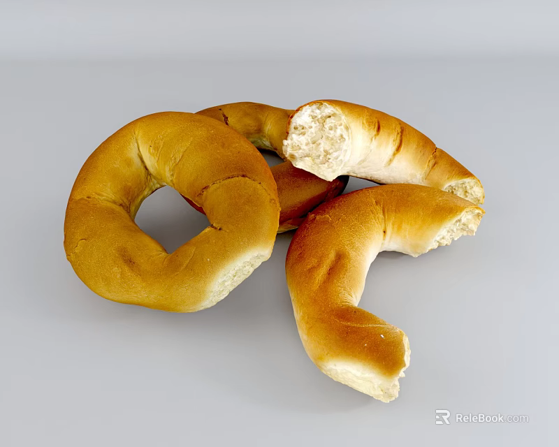 Golden Brown Freshly Baked Bagels With Bitten Pieces And Soft Interior 3d model 