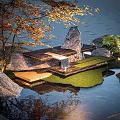 Tranquil Natural Landscape With Rock Water Grass Autumn Tree And Wooden Platform