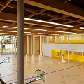 Spacious Basketball Gym Interior With Wooden Floor Hoops And Bright Lighting