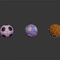 Three Stylish Household Balls With Black White Soccer Colorful Patterned And Orange Hexagonal Designs
