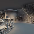 Cultural Center Featuring Circular Mud Brick Building Dark Roof Surrounding Trees And Wooden Fences