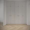 Modern Minimalist White Wardrobe With Six Panel Doors And Brass Handles On Herringbone Wooden Floor