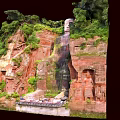 Scenic Garden Landscape Featuring Giant Rock Carving And Dense Mountain Vegetation