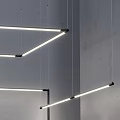 Modern Linear Chandelier Design With Hanging LED Lights And Architectural Lines