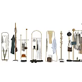 Stylish Clothes Display with Gold Racks Hanging Dresses Shirts and Accessories