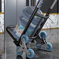Hand Truck With Large Water Bucket And Blue Wheels In Marble Lobby