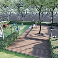 Residential Landscape With Green Lawn Wooden Deck Trees Play Structures And Seating Area