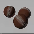 Three Red Cricket Balls With White Stitching On Dark Background