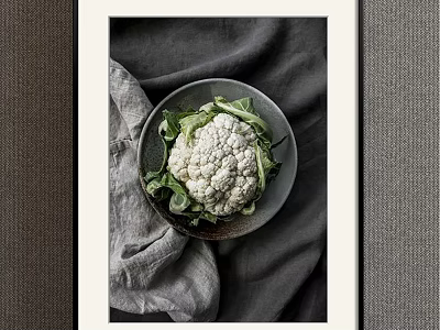 Organic Fresh Cauliflower With Green Leaves On Ceramic Plate And Gray Cloth 3d model