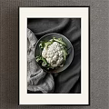 Organic Fresh Cauliflower With Green Leaves On Ceramic Plate And Gray Cloth