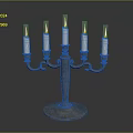 Ornate Five Candle Metal Candelabra With Decorative Base And Lit Wicks