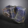 Blue Purple Irregular Stone With Natural Texture And Cracks On Dark Background