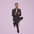 Man in Black Suit With Tie Sitting on Chair Clapping Hands Against Light Purple Background