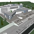 Campus Area With Connected Buildings Surrounding Trees Lawns Parking And Roadways