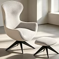 Modern Light Gray Lounge Chair With Ottoman And Black Three Legged Base In Bright Room